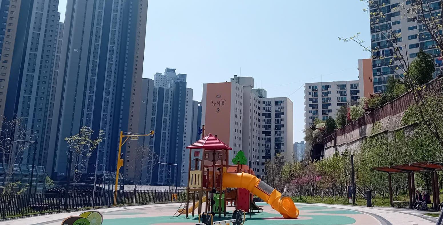 playground surrounded by apartments